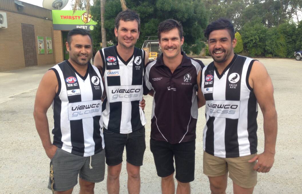 Derek Murray (left) and brother Matt (right) with Pies backman Casey Hillary and coach Tom Yates.