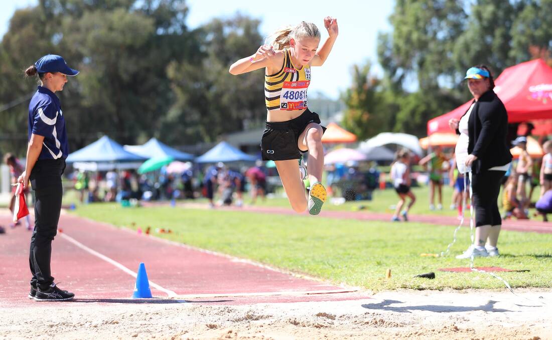 AIRBORNE: Wagga's Sophie Wheatley launches in the long jump at the State Multi-Event at Jubilee Park on the weekend. Picture: Kieren L Tilly