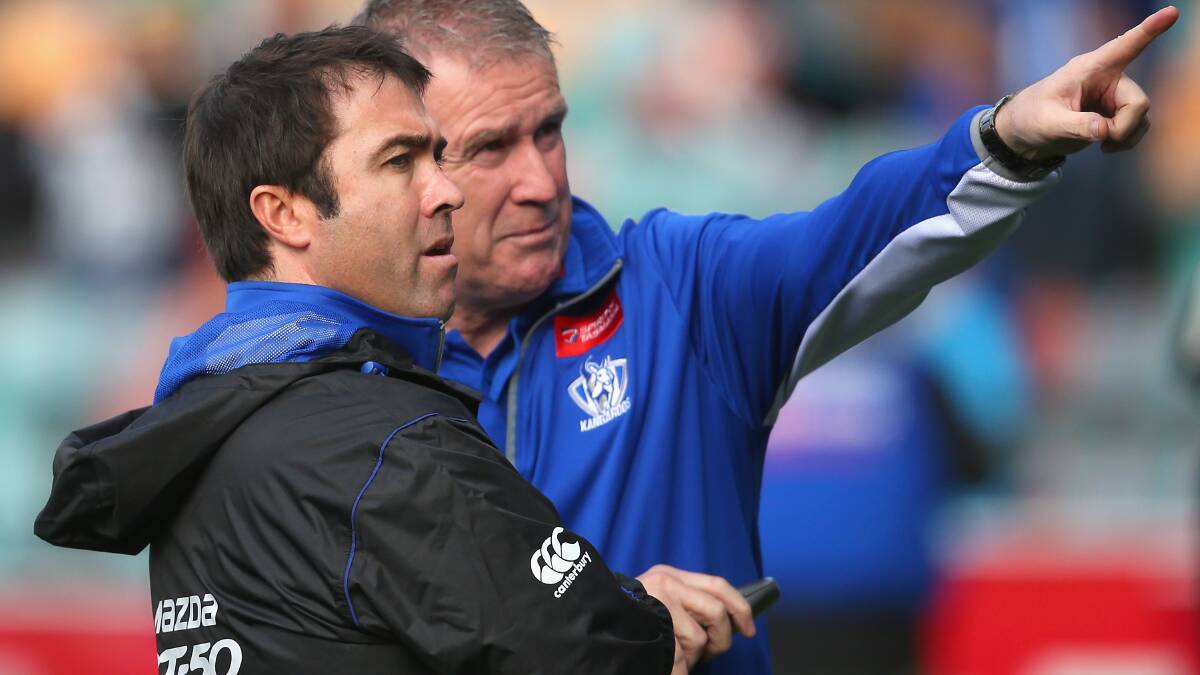 North Melbourne director of football, Geoff Walsh, points to a bright future at the Kangaroos under coach Brad Scott (left). Picture: Getty Images