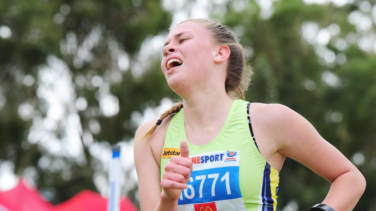DESPERATION: Hannah Mison, 15, of Kooringal-Wagga club gives her all on the way to victory in her 1500m walk on Sunday. Picture: Kieren L Tilly