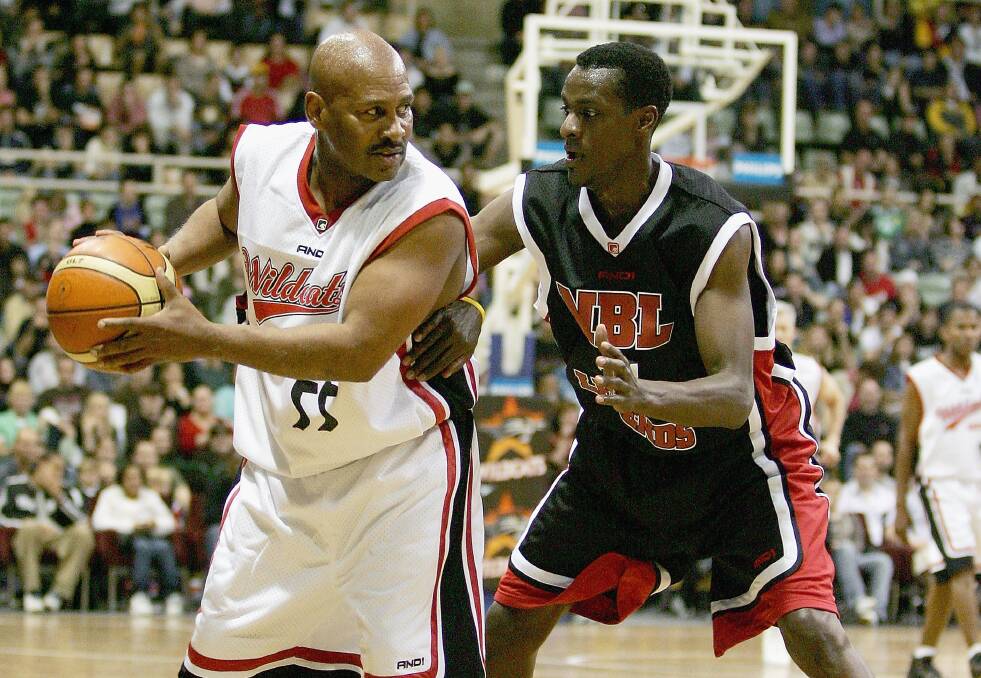Cal Bruton (left) playing for the Perth Wildcats All Stars against NBL Legends' Lanard Copeland in a 2005 testimonial match. Picture: Getty Images