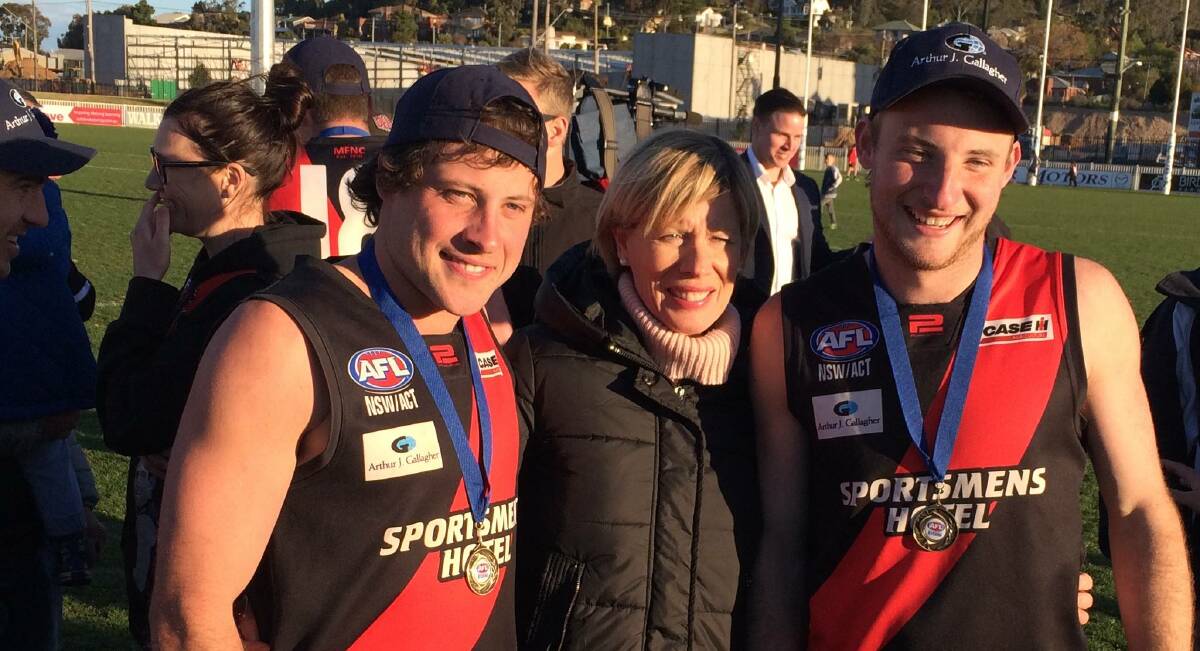 BOMBERS BROTHERS: Tyler and Jesse Cunningham with mum Sandra after Marrar's victory.