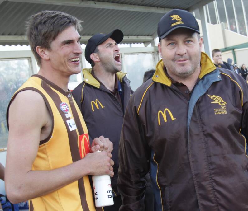 EWK's Zac Robinson with coach Gavin McMahon as full-time approaches in the Farrer League grand final.