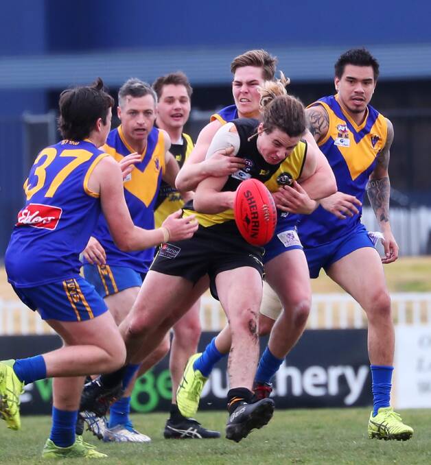 CLUBS TO BE CANVASSED: Riverina League teams Wagga Tigers and Narrandera doing battle last month. Clubs will be consulted in the review.