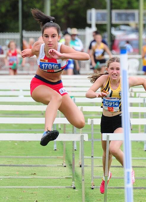 Stretching out: Albion Park's Jayda Amidzovski, 12, (left). Picture: Kieren L Tilly