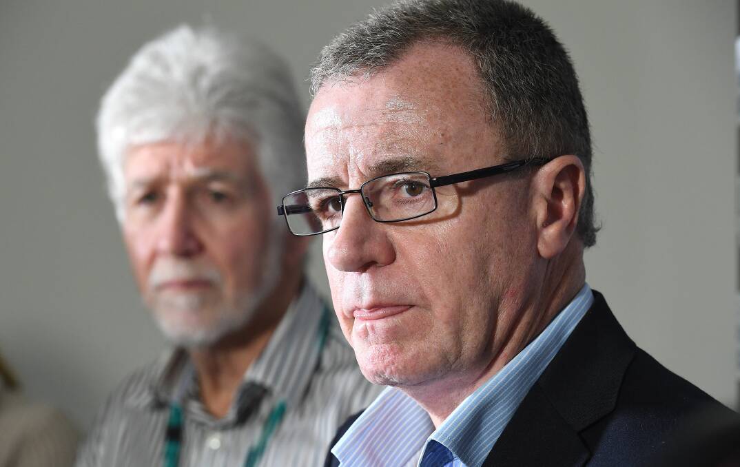 Darryl Kelly (left) alongside Titans CEO Graham Annesley in August. Picture: AAP