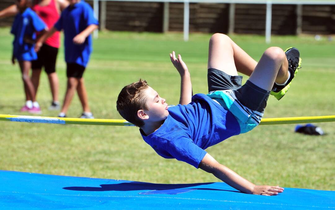 AIRBORNE: Age champion Tye Buckby, 11, launches himself in the high jump at Jubilee Park on Thursday. Picture: Kieren L Tilly