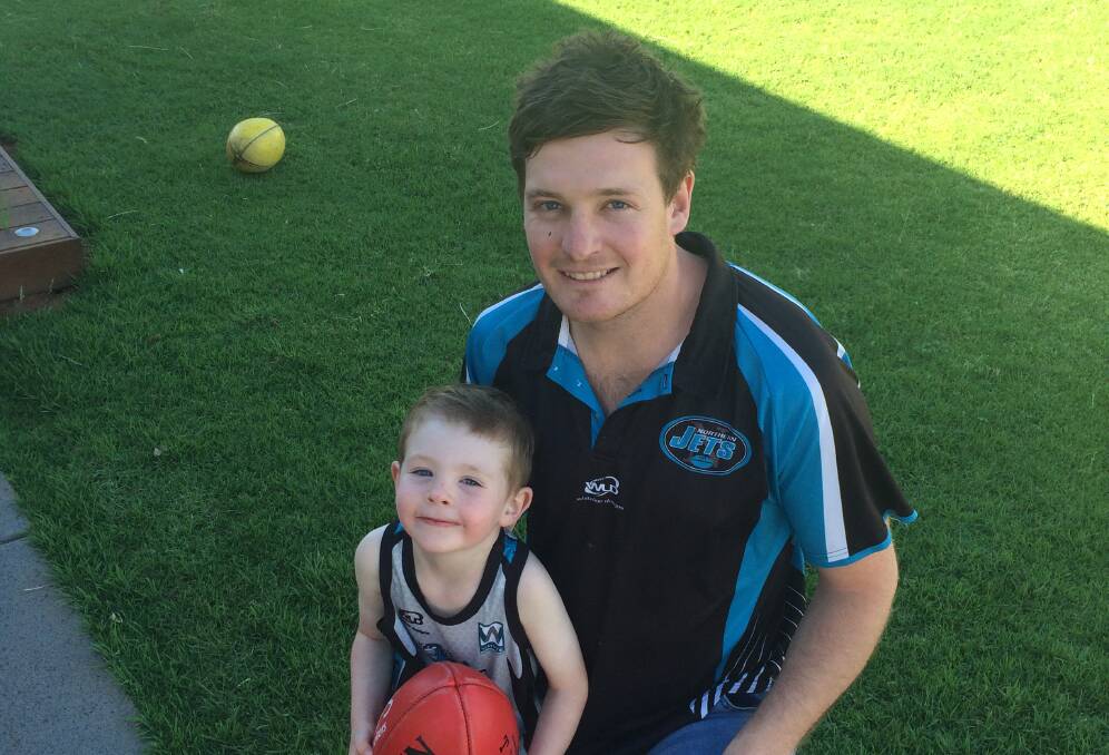 Northern Jets coach Mitch Robinson with son Charlie.