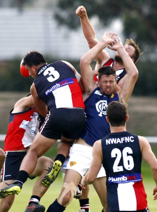 Photographer Les Smith captures the action as Saints outclass Coleambally at McPherson Oval. 