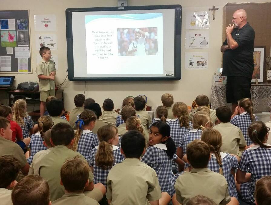BIG NEWS: Nayte Cuneen, 9, took former Australian Test cricketer Merv Hughes to school on Friday as an item of 'news' for his year 4 classmates at Henschke Primary. Hughes was in Wagga for a charity golf tournament.