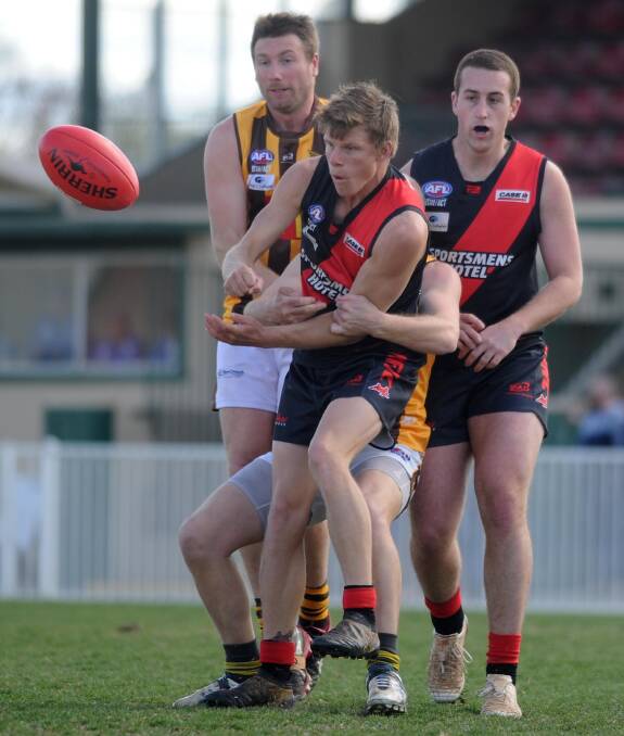 Chris Hommes wraps up Rory Block during the preliminary final. Picture: Laura Hardwick