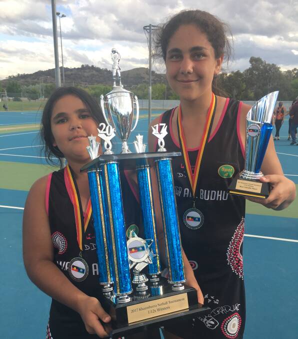 SPOILS OF VICTORY: Tamsyn Goolagong, 12, right, with sister Kaelani 