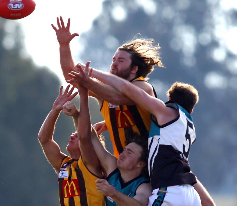 Jets coach Mitch Robinson, right, effects a spoil against East Wagga-Kooringal. Picture