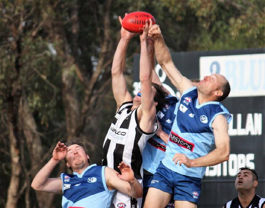 IN THE AIR: Barellan president Jeff Mickan in the ruck last week against TRYC. Mickan says the club is in the market for a playing coach next year. The Two Blues hope to finish the season with another upset against Marrar on Saturday.