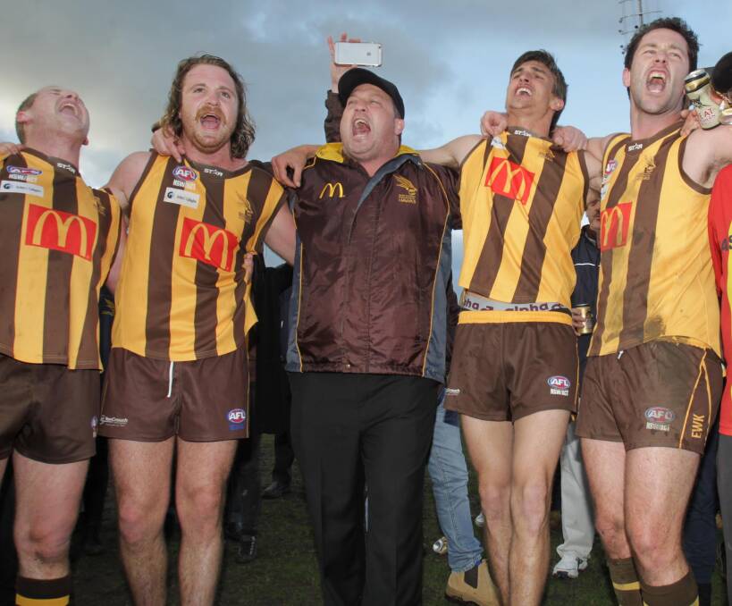 ON SONG: James Hodges, second from left, celebrates the win. Picture: Les Smith