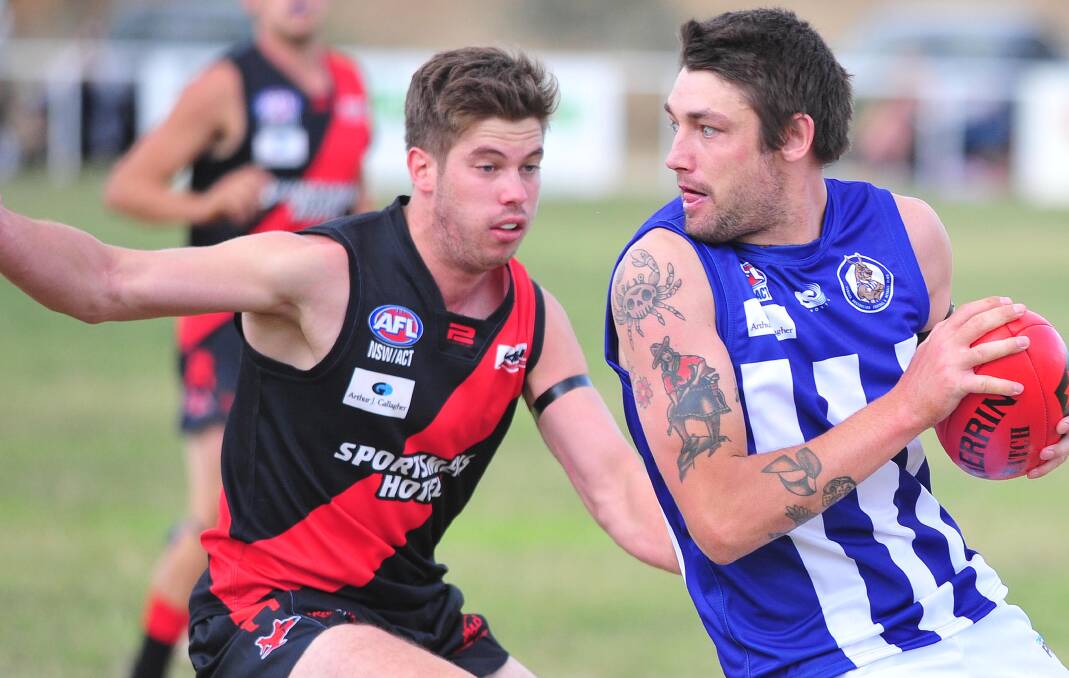 SIDELINED: Marrar's Cal Gardner keeps the pressure on Temora's Kane Peeters earlier this year. The Bombers' assistant coach will miss the next month with a finger injury. Picture: Kieren L Tilly