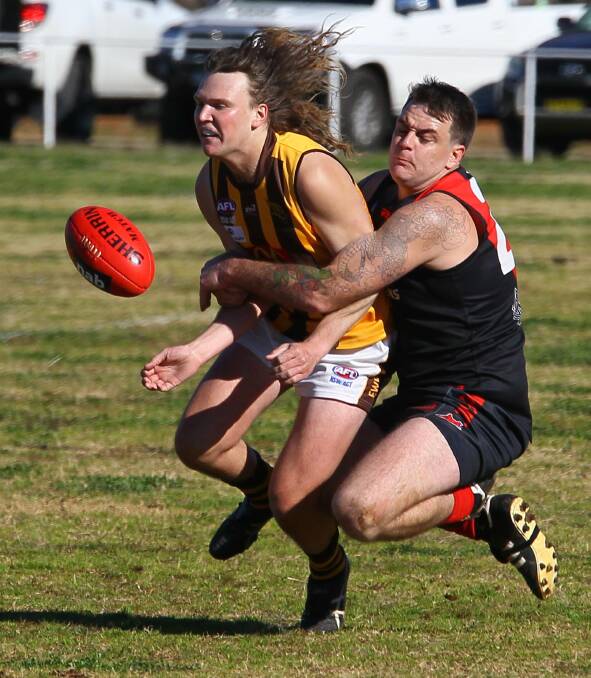 CAUGHT: Marrar's Shannon Williams runs down Hawk Mitch Castles early in the Bombers' win at Langtry Oval on Saturday. Picture: Les Smith