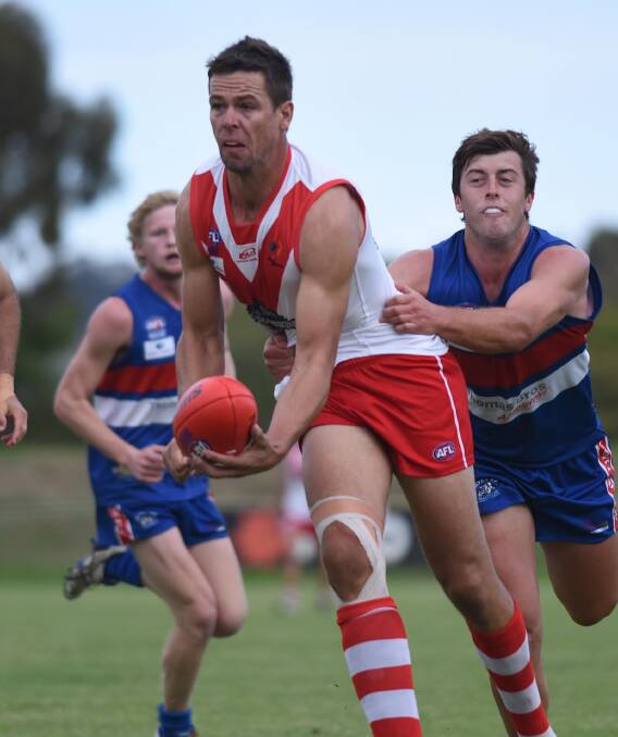 MAKING PLANS: Incoming Coleambally coach Michael Griffiths in action for the Griffith Swans early in 2015. The big ruckman arrives at the Farrer League club next week. Picture: Laura Hardwick