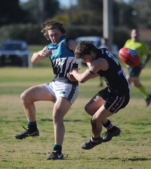 LET'S DANCE: Northern Jets co-captain Sam Fisher and North Wagga backman Angus McRae tangle at McPherson Oval on Saturday. Picture: Laura Hardwick