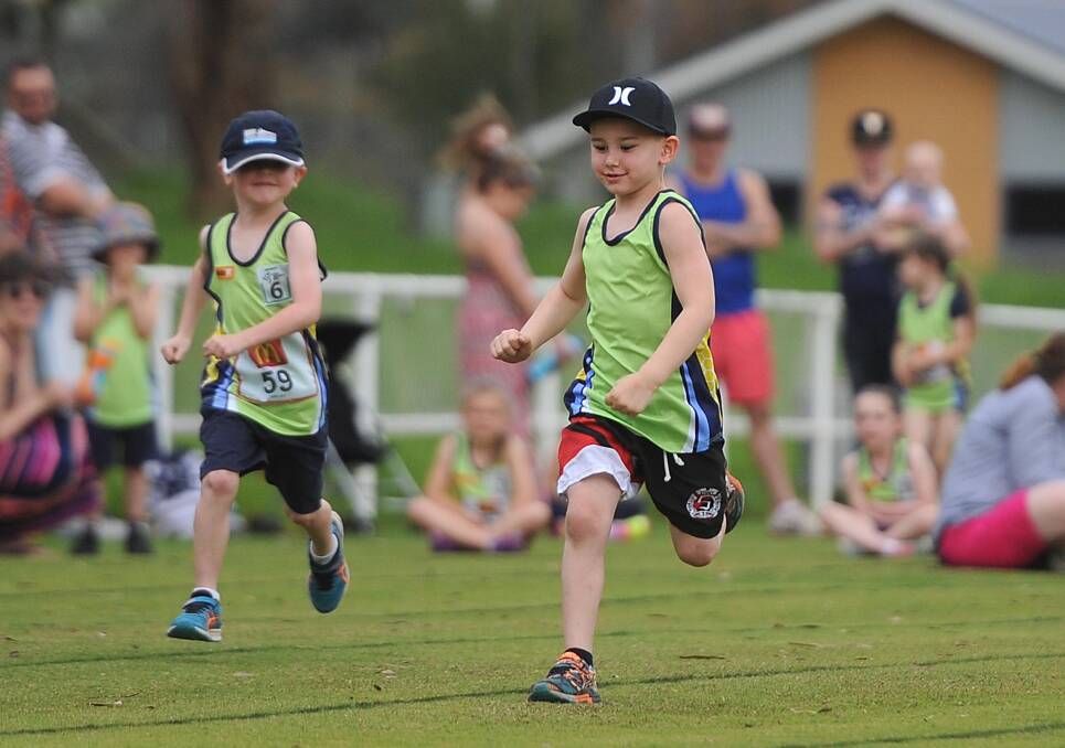 Six-year old Jaxon Carr, right, setting the pace on the track at Kooringal-Wagga's opening night of the Little Athletics season. Picture: Laura Hardwick