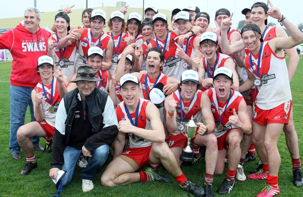 SMILING SWANS: Griffith's successful under 17 side celebrates a runaway victory over Leeton-Whitton at Robertson Oval on Sunday. Picture: Les Smith
