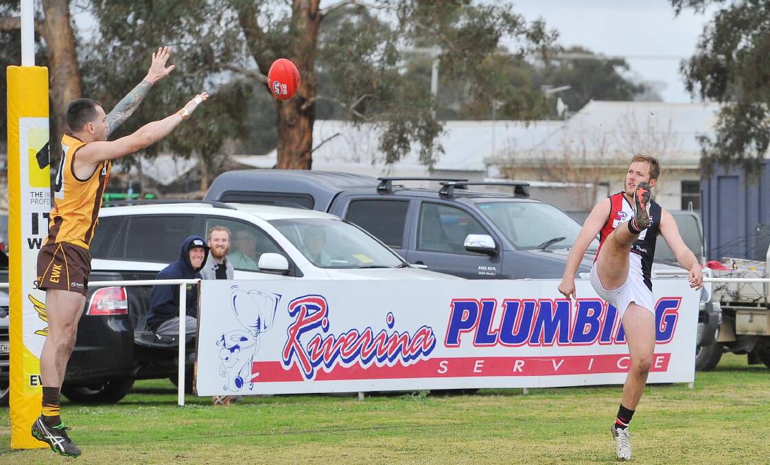 GOING BANANAS: North Wagga forward Alex Grozinger kicks one of his five goals against East Wagga-Kooringal at Gumly. Picture: Kieren L Tilly