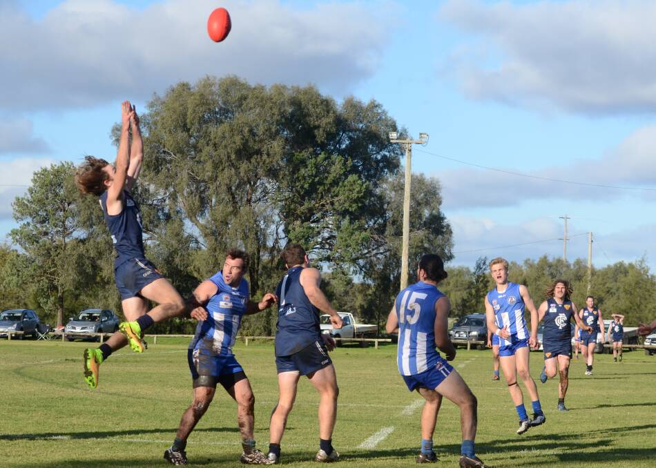 HITTING GREAT HEIGHTS: Coleambally's Jacob Breed flies for a mark during the Blues' win over Temora on Saturday. Picture: Riley Krause