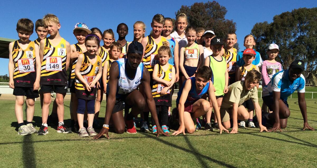 FACES OF THE FUTURE: Little athletes gather on the start line at Jubilee Park as Wagga's two clubs kick off a campaign for a synthetic all-weather track in the city.