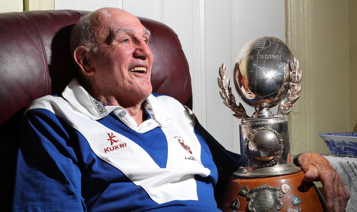 GLORY DAYS: Former British league star Phil Jackson with the World Cup best-and-fairest trophy he won at the 1957 tournament in Australia (and won by Australia). He also played in Great Britain's 1954 World Cup success in France. Picture: Kieren L Tilly