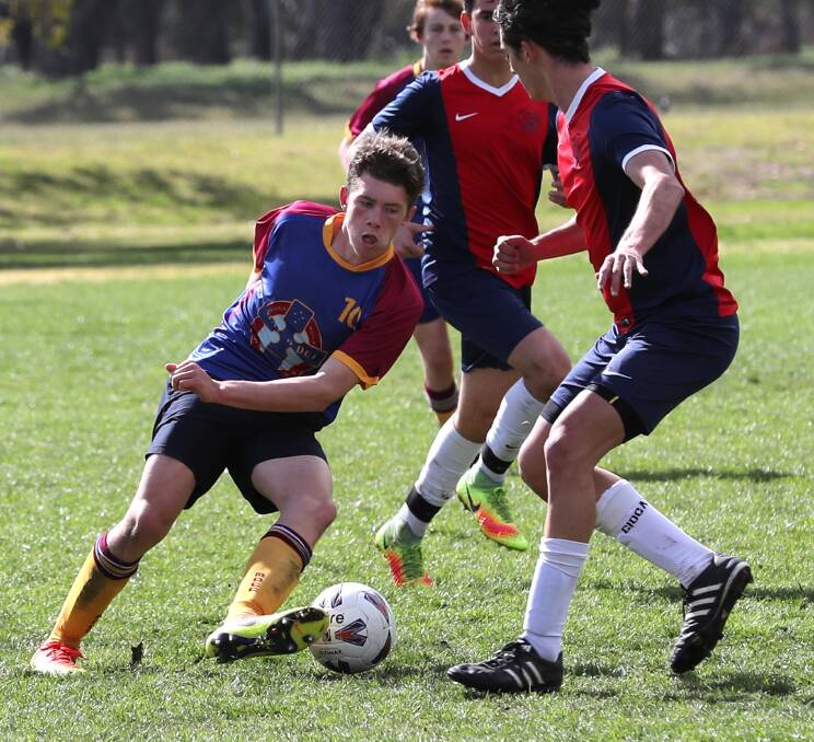Les Smith snaps the action as MDCC progress to the final four of the statewide NSWCCC open soccer competition.