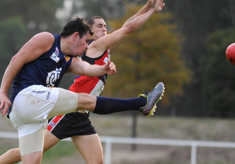 MOVED ON: Simon Mackie in trademark pose against North Wagga last season. The Blues star has moved to the south coast with family. Picture: Laura Hardwick