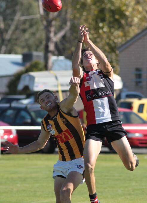 Guy McAlister effects a spoil against North Wagga's Corey Watt. Picture: Les Smith