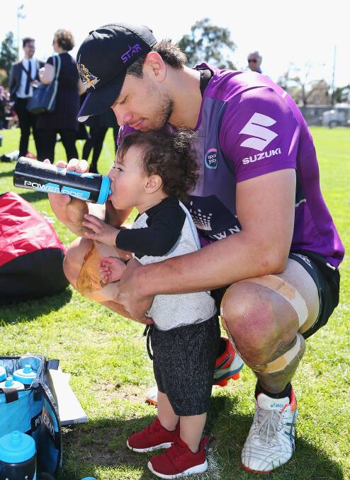 YOUNG STAR: Melbourne's Jordan McLean with son Archie this week.