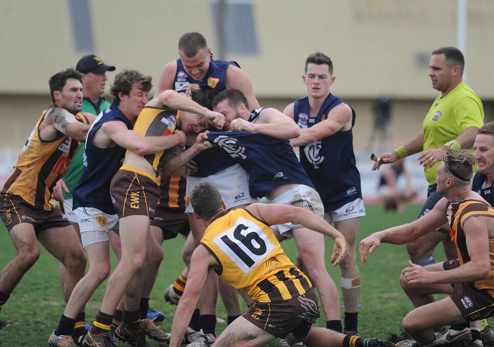 MELEE: Players rush in as the second-quarter incident threatens to escalate. There were no reports but the altercation lit the fuse for a fiery follow-up.