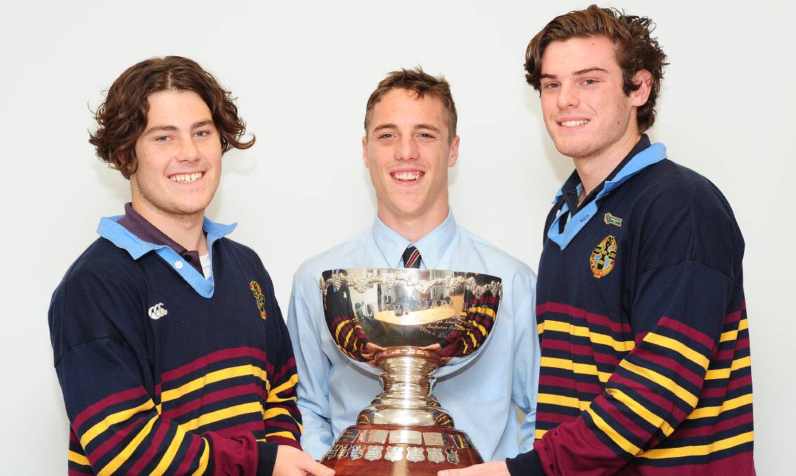 FIGHT FOR THE PRIZE: Mater Dei co-captains Jake Hodge (left) and Mitch Wadley flank Kildare co-captain Tom Anderson ahead of the Carroll Cup final. Picture: Kieren L Tilly