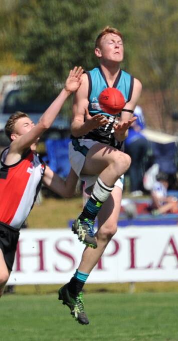 RETURNING: Aidan Cattle in action for the Jets' under 17s in the 2014 grand final.