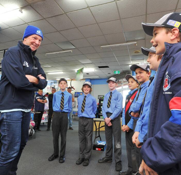 INSPIRATION: Neale Daniher talks to Henschke primary students who wrote letters to him as their hero: (from left) Max Newley, Charlie Stratton, Will Voss, Charlie Hounsell, Jack Crouch, Isaac Buchanan and Jack Glanville. 