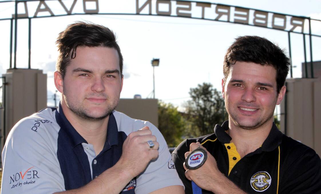 PREMIERSHIP BLING: Southcity's Jordan Shepherd with his winner's ring and brother Lahn with the spoils of Tigers' success. Picture: Les Smith