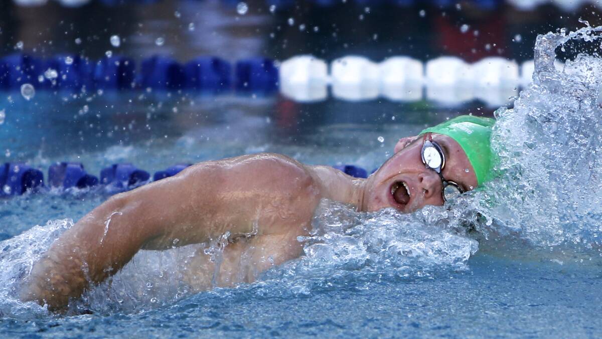 OUT IN FRONT: Rhyce Waters, 18, powers to victory in his 50m freestyle heat at the Kildare Catholic College swimming carnival on Thursday night. Picture: Les Smith