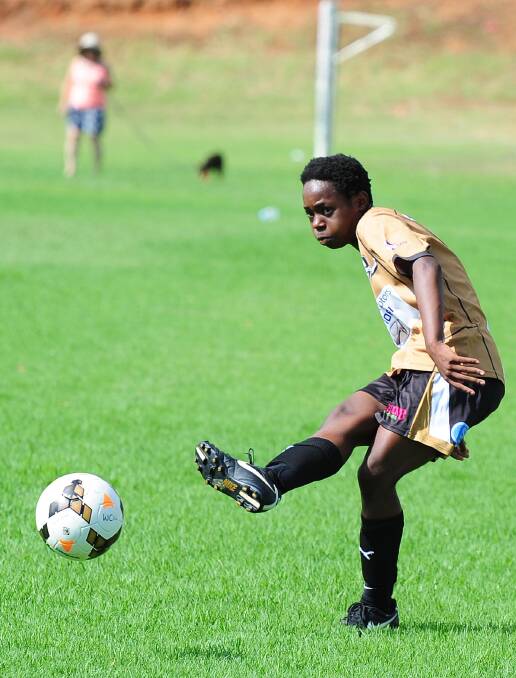 PRE-SEASON HIT-OUT: Ano Matowe is a picture of concentration during the Wagga City Wanderers' under 20s trial against the under 18's at Gissing Oval on Sunday. Picture: Kieren L Tilly