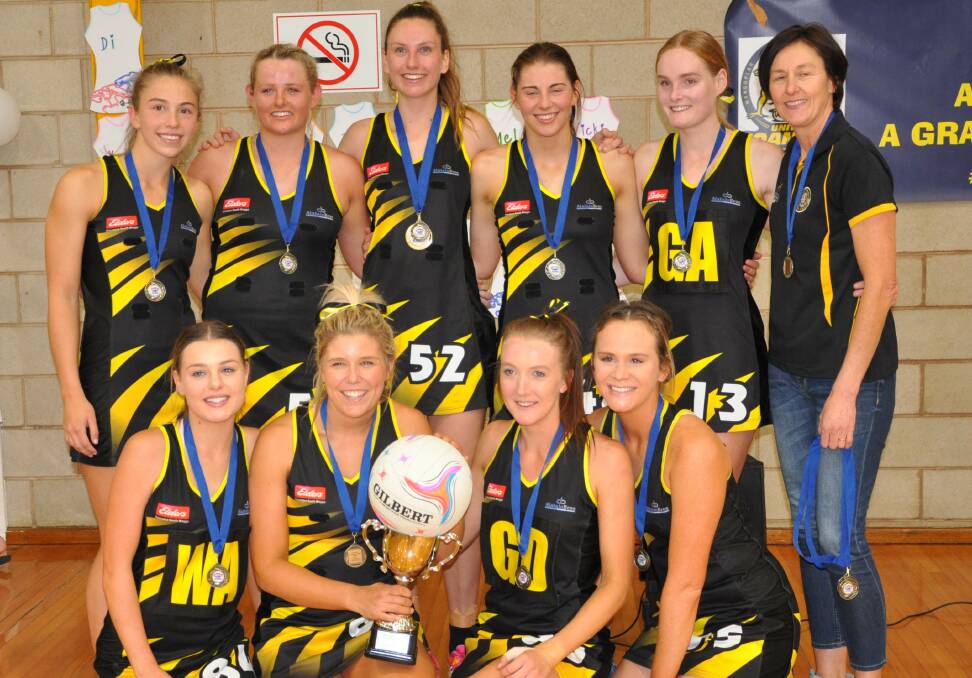 THE DOUBLE: Wagga Tigers celebrate consecutive A grade netball premierships after their nine-goal win over MCUE at Narrandera on Saturday.