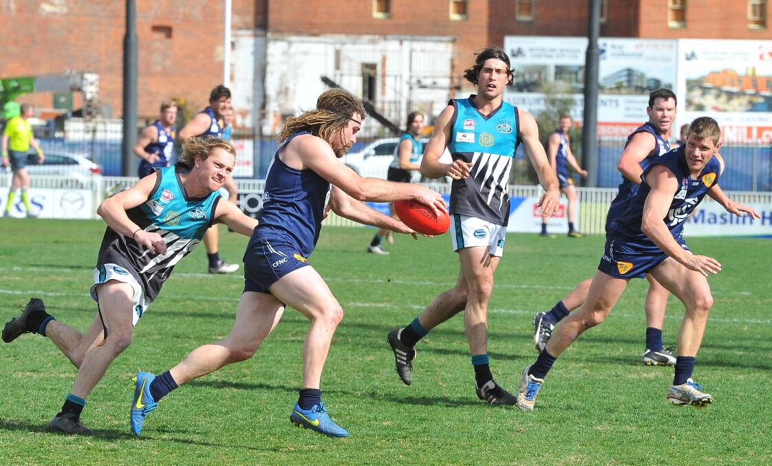 KENNA BELIEVE IT: Coleambally midfielder Drew Kenna drives his side forward in Saturday's drama-charged preliminary final against the Jets. 
