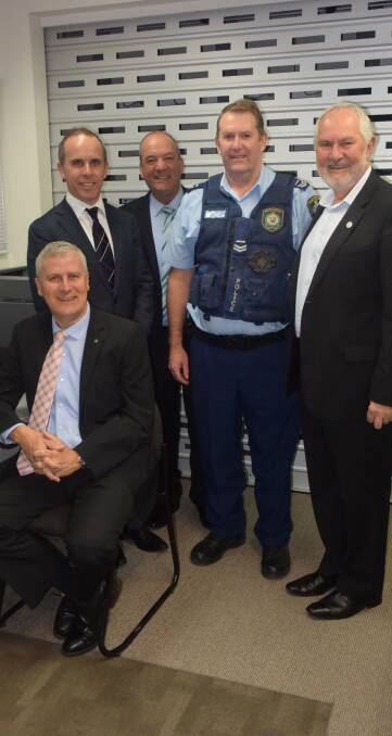 Riverina MP Michael McCormack, C4W representative Scott Braid, Wagga MP Daryl Maguire, Mick Connor and mayor Rod Kendall view rolling CCTV coverage.