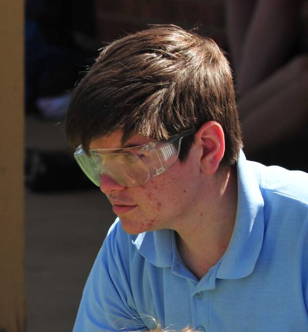 CONCENTRATION: Wagga High's Brandon Atkinson, 15, in action at the Science and Engineering Challenge at MTC.