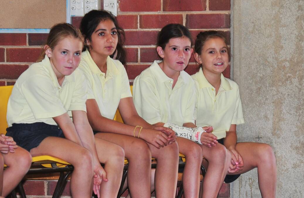 South Wagga Public School's Tessa Newton, Maryam Gardner, Piper Linsell and Meg Callaghan watch Amber Lawrence perform. 