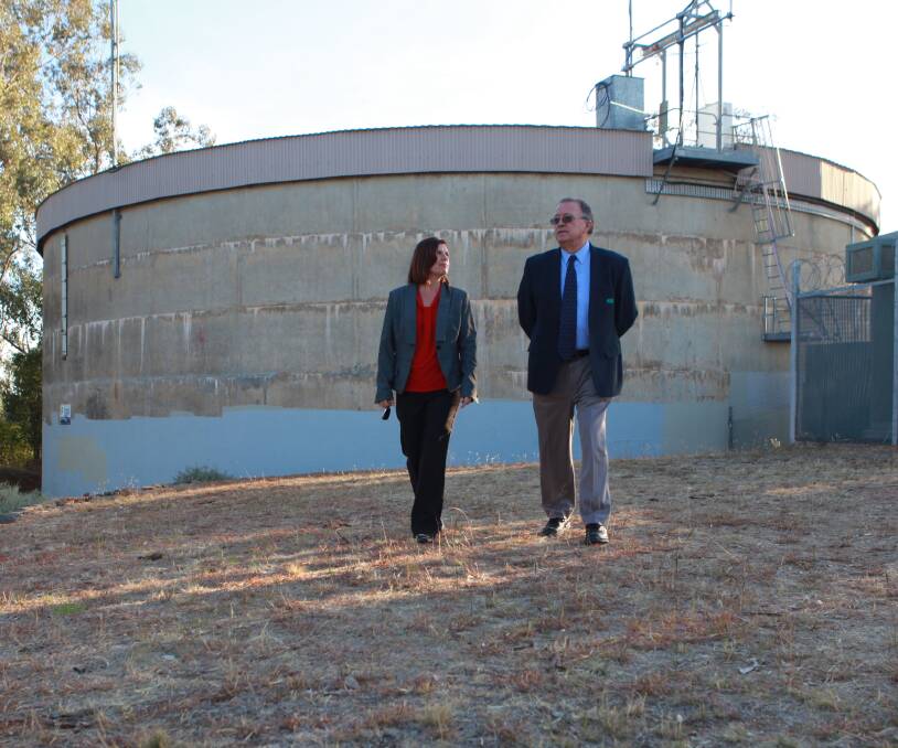 FACELIFT: Council director Janice Summerhayes and Riverina Water chief Graeme Haley inspect what will become Wagga's largest mural. Picture: Wagga City Council 