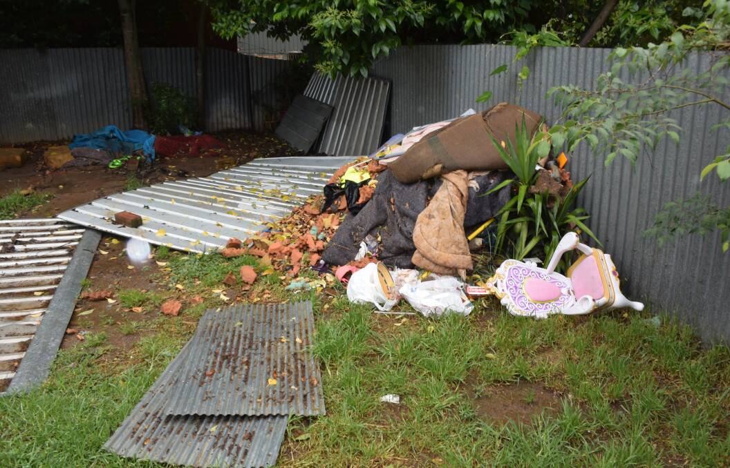 DUMPED: This pile of rubbish is one of the many shocking sights the landlord found when her tenants were finally evicted from the Turvey Park rental property. 