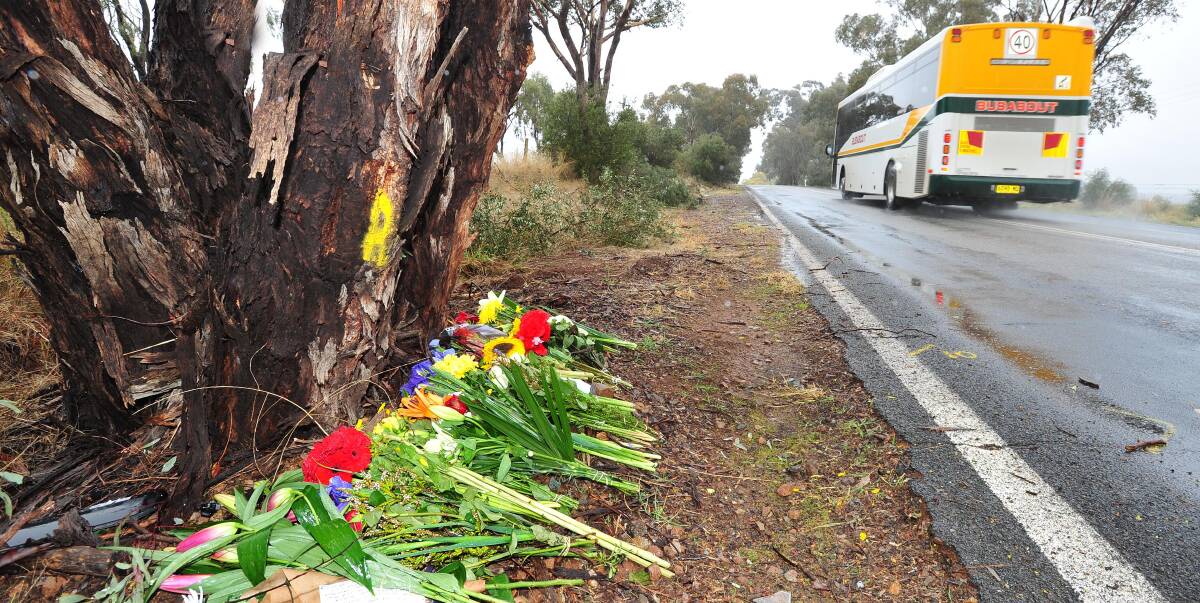IN MEMORY: Friends and family have left tributes on Pine Gully Road after 18-year-old, Peter Murray, died in an accident along the dangerous stretch last Saturday morning. Picture: Kieren L Tilly