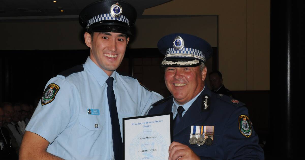 ALL SMILES: Wagga's newest recruit, Probationary Constable Thomas MacGregor, with Southern Region Commander, Assistant Commissioner Gary Worboys.