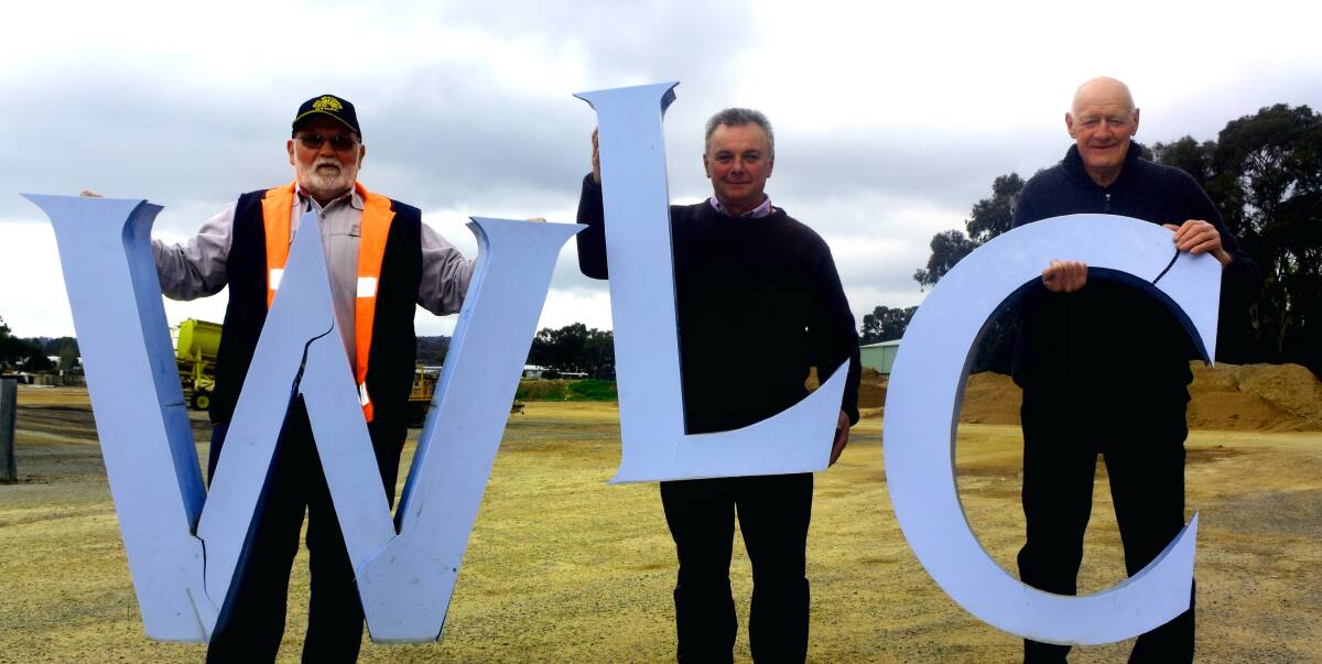 LEASE OF LIFE: Gil Mathew bought the iconic Wagga Leagues Club sign and donated it to the Museum of Riverina, a donation celebrated by Luke Grealy and David Mulrooney. Picture:Olivia Shying